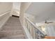 Carpeted staircase leading to the upper level at 11837 Wildeflower Pl, Temple Terrace, FL 33617