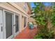 Private patio with brick pavers and small table at 11837 Wildeflower Pl, Temple Terrace, FL 33617