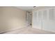 Bedroom with double door closet and neutral wall at 11837 Wildeflower Pl, Temple Terrace, FL 33617