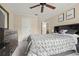 Bedroom with ceiling fan and inspiring wall art at 11837 Wildeflower Pl, Temple Terrace, FL 33617