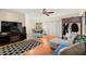 Spacious living room with hardwood floors and entertainment center at 11837 Wildeflower Pl, Temple Terrace, FL 33617