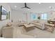 Relaxing living room featuring light neutral colored sofas and coffee table at 9261 Highland Hills Dr, Hudson, FL 34667