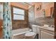 Clean bathroom with wood-look tile and a white vanity at 3108 58Th S St, Gulfport, FL 33707