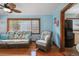Living room with wicker furniture, light blue walls, and hardwood floors at 3108 58Th S St, Gulfport, FL 33707