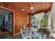 Sunroom with glass walls, wood paneling, and access to other rooms at 3108 58Th S St, Gulfport, FL 33707