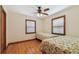 Second bedroom with hardwood floors and twin beds at 3108 58Th S St, Gulfport, FL 33707