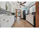 Bright kitchen with white cabinets, marble countertops, and tile flooring at 3108 58Th S St, Gulfport, FL 33707