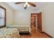 Bedroom with hardwood floors and twin beds with lemon print comforter at 3108 58Th S St, Gulfport, FL 33707