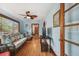 Living room with wicker furniture, light blue walls, and hardwood floors at 3108 58Th S St, Gulfport, FL 33707