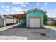 Charming teal garage with orange trim and covered parking at 3108 58Th S St, Gulfport, FL 33707