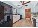 Kitchen with white cabinets, black appliances, and tile backsplash at 3108 58Th S St, Gulfport, FL 33707