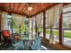 Bright sunroom with glass walls, seating area, and wood ceiling at 3108 58Th S St, Gulfport, FL 33707