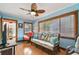 Living room with wicker furniture, light blue walls, and hardwood floors at 3108 58Th S St, Gulfport, FL 33707