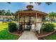 Screened-in gazebo with seating for residents at 3345 Crystal E Ct # F, Palm Harbor, FL 34685