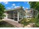 Backyard view showing pool, screened patio, and grill at 2517 Trinidad St, Sarasota, FL 34231