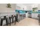 Modern kitchen with stainless steel appliances and breakfast bar at 2517 Trinidad St, Sarasota, FL 34231