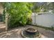 Backyard patio with fire pit and lush landscaping at 2517 Trinidad St, Sarasota, FL 34231