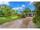 House with a spacious front yard and brick paver driveway at 2517 Trinidad St, Sarasota, FL 34231