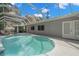 Inviting kidney-shaped pool with screened enclosure at 2517 Trinidad St, Sarasota, FL 34231