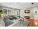 Bright living room, featuring hardwood floors and access to backyard at 2517 Trinidad St, Sarasota, FL 34231
