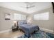 Guest bedroom with a queen bed and ample natural light at 2517 Trinidad St, Sarasota, FL 34231