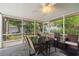 Relaxing screened porch with seating and dining area at 2517 Trinidad St, Sarasota, FL 34231