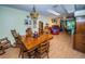 Charming dining room featuring a wood table and chairs at 865 Maclaren N Dr # D, Palm Harbor, FL 34684