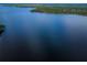 Stunning aerial view showcasing the expansive lake and surrounding landscape at 865 Maclaren N Dr # D, Palm Harbor, FL 34684
