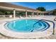 Relaxing community hot tub with seating area at 865 Maclaren N Dr # D, Palm Harbor, FL 34684