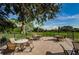 Patio furniture on a brick patio overlooking a golf course at 865 Maclaren N Dr # D, Palm Harbor, FL 34684
