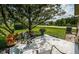 Relaxing patio area with seating and lush landscaping at 865 Maclaren N Dr # D, Palm Harbor, FL 34684