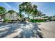 Community building exterior with covered walkway at 865 Maclaren N Dr # D, Palm Harbor, FL 34684