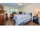 Comfortable bedroom with a double bed, and hardwood floors at 865 Maclaren N Dr # D, Palm Harbor, FL 34684