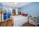 Bedroom with a double bed, built-in shelving and wood floors at 865 Maclaren N Dr # D, Palm Harbor, FL 34684