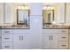 Double vanity bathroom with granite countertops and white cabinets at 865 Maclaren N Dr # D, Palm Harbor, FL 34684
