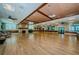 Spacious community room with hardwood floors and fireplace at 865 Maclaren N Dr # D, Palm Harbor, FL 34684