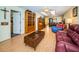 Living room with hardwood floors, leather furniture and built-in shelving at 865 Maclaren N Dr # D, Palm Harbor, FL 34684