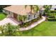 Aerial view of house with tile roof, landscaping, and driveway at 19003 Apian Way, Lutz, FL 33558