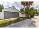 Detached garage with gray door and ample space at 2609 Dartmouth N Ave, St Petersburg, FL 33713