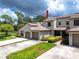 Two-story townhome with attached garage and landscaping at 602 Quail Keep Dr, Safety Harbor, FL 34695