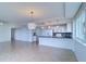 Spacious dining area with tile floors and access to balcony at 223 Island Way # 5D, Clearwater Beach, FL 33767