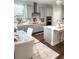 Modern kitchen with gray cabinets, white countertops, and a large island at 1301 22Nd N Ave, St Petersburg, FL 33704