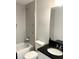 Clean bathroom with tub, toilet, and dark vanity at 1301 22Nd N Ave, St Petersburg, FL 33704