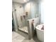 Modern bathroom with a large walk-in shower and freestanding tub at 1301 22Nd N Ave, St Petersburg, FL 33704