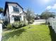 Two-story house with a landscaped front yard and white fence at 1301 22Nd N Ave, St Petersburg, FL 33704