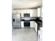 Modern kitchen with stainless steel appliances and white cabinets at 1301 22Nd N Ave, St Petersburg, FL 33704
