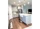 Modern kitchen with gray cabinets, white quartz countertops, and a large island at 1301 22Nd N Ave, St Petersburg, FL 33704