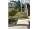 Large backyard with a grassy area and a palm tree at 1301 22Nd N Ave, St Petersburg, FL 33704