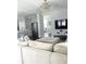 Open living room with large sectional sofa and a view into the kitchen at 1301 22Nd N Ave, St Petersburg, FL 33704