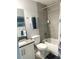 Bathroom with gray tile, white vanity and shower/tub combo at 1301 22Nd N Ave, St Petersburg, FL 33704